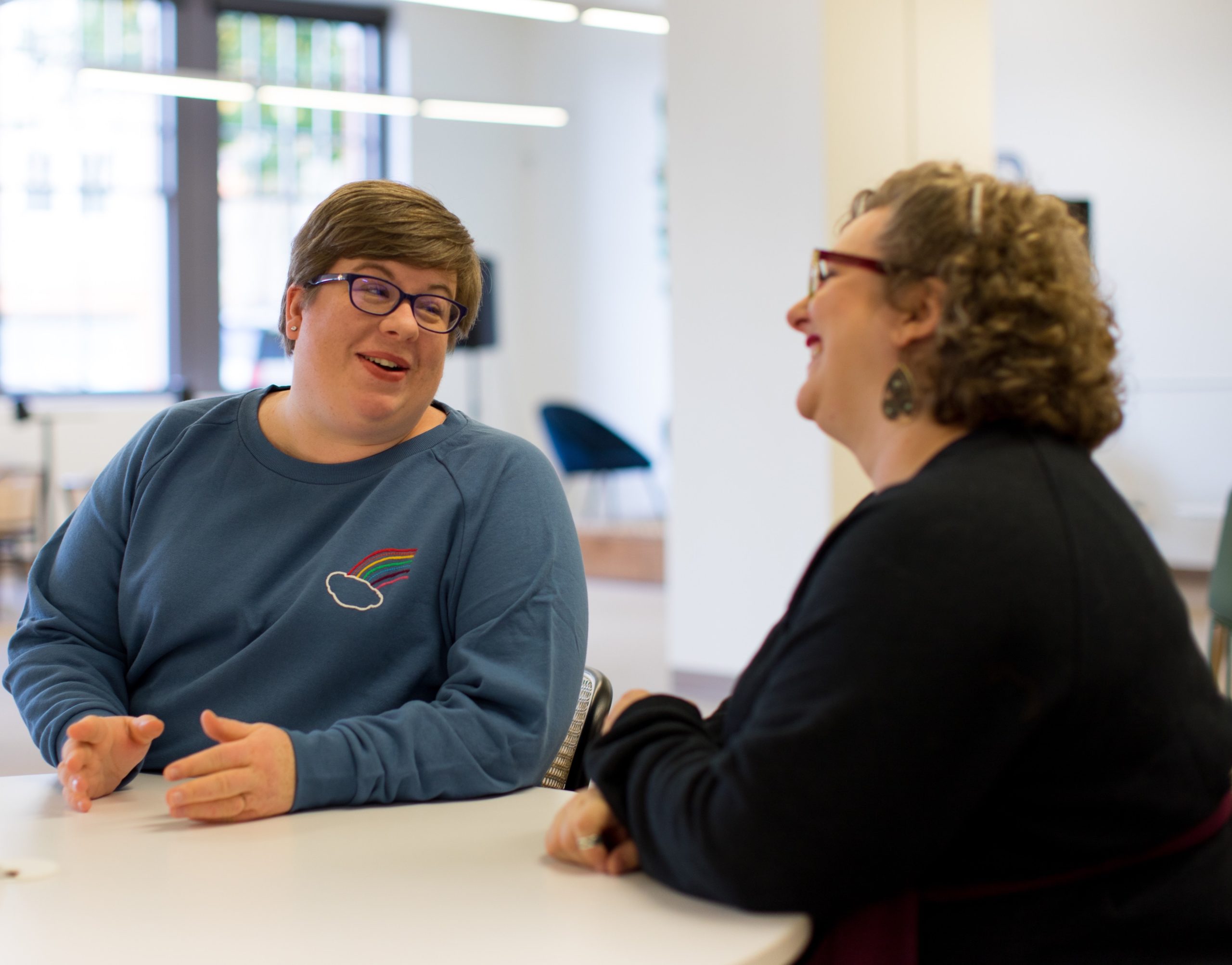 Two people talking about getting mental health care. Image courtesy of Unsplash.